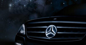 Pixel-inspired illuminated Mercedes grille at night